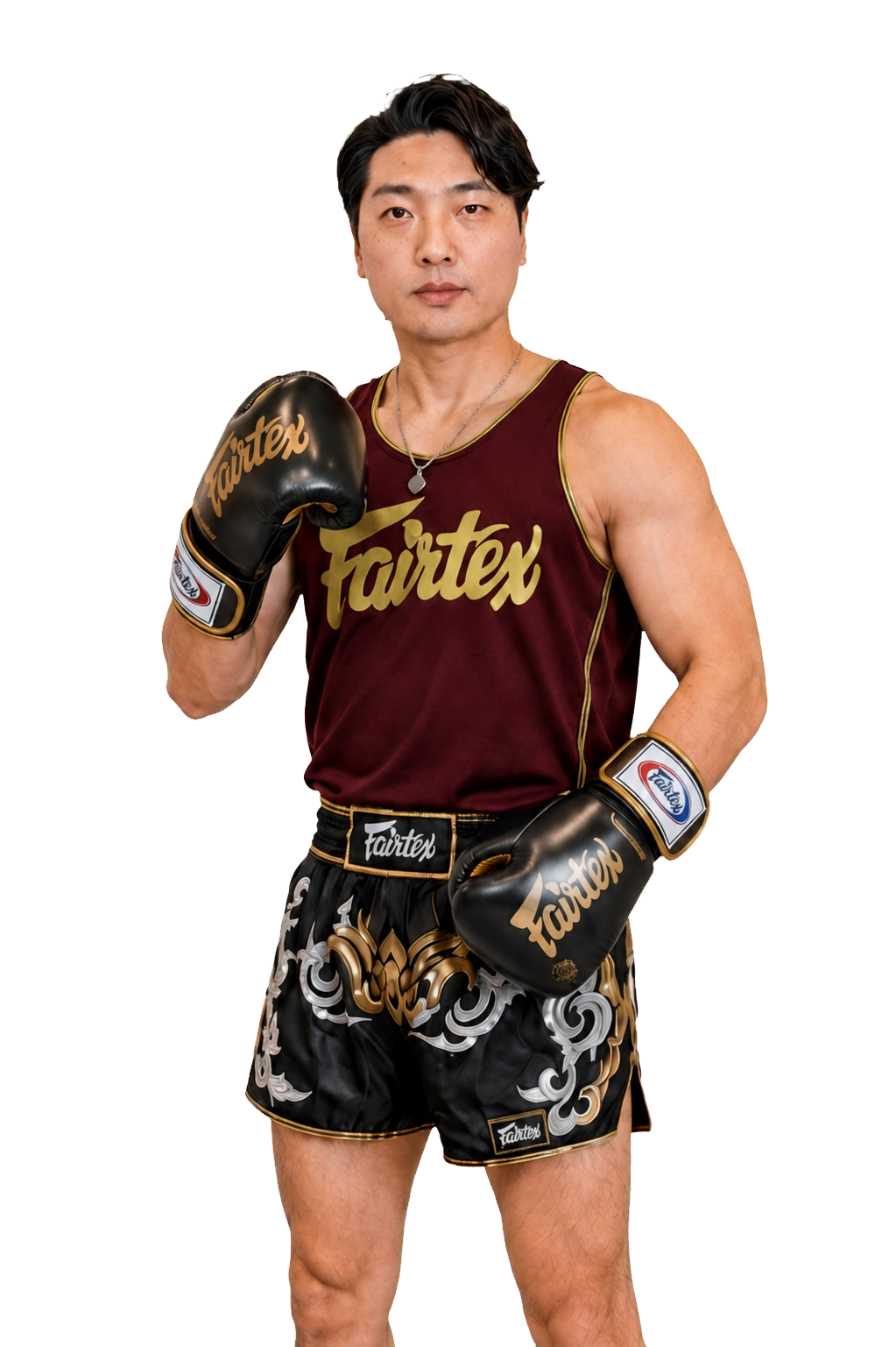 Coach Ben wearing burgundy and gold Fairtex Muay Thai training gear